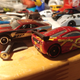 Seen here with its wheel donor Camaro. I’m going to remove the silver lip and paint the wheels yellow, and they’ll look a lot like the yellow five spoke wheels on the 1:1!